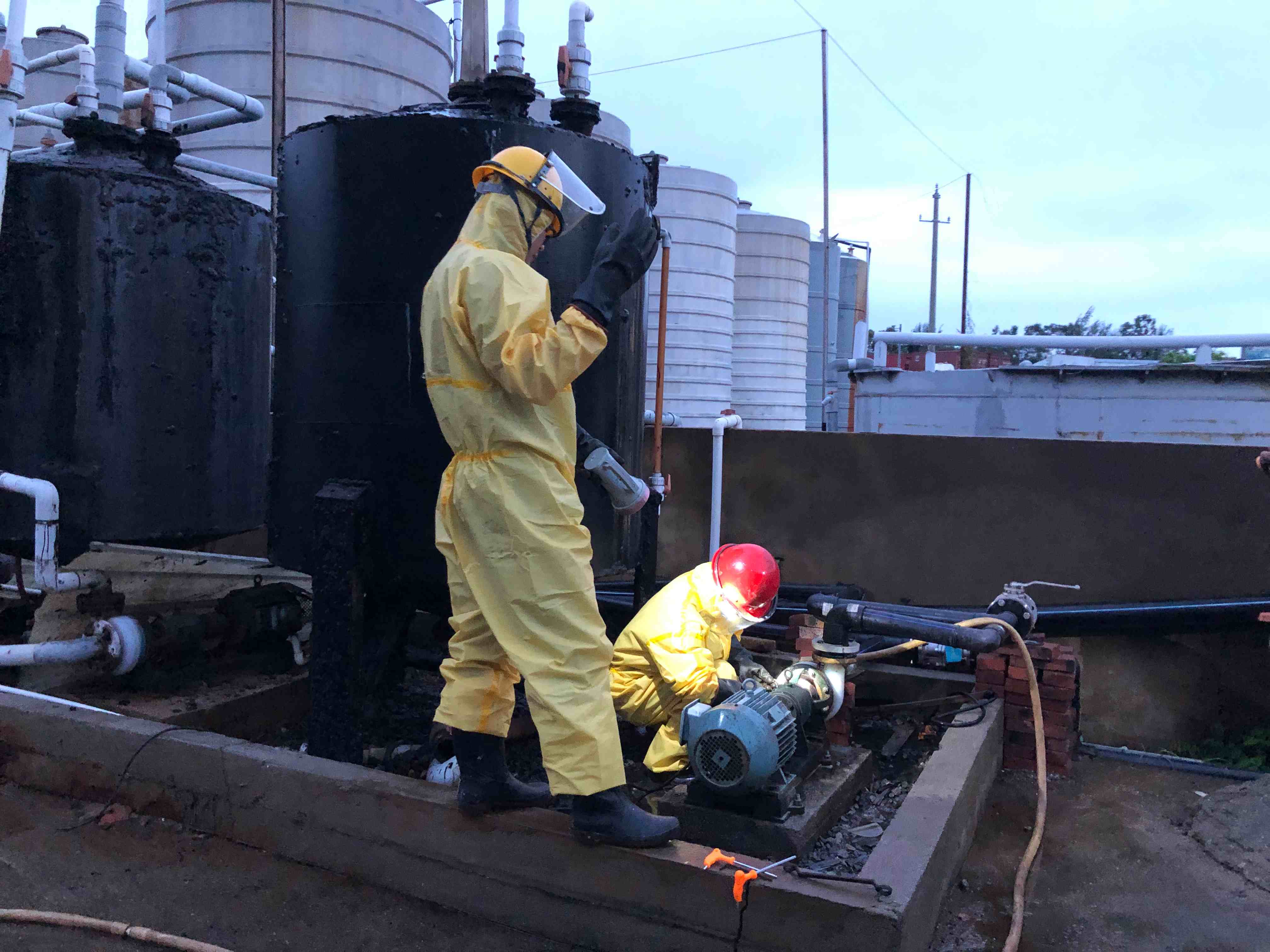 Chemical facility safety inspection in full protective equipment